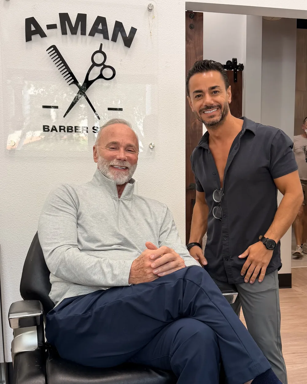 Client and barber at A-Man Barbershop