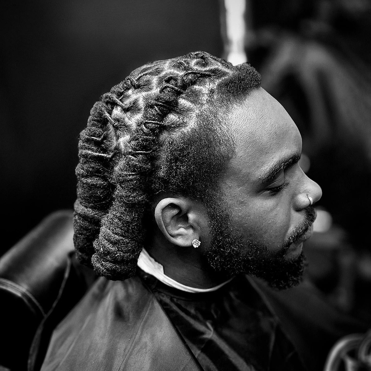 Braided hairstyle with a clean side fade