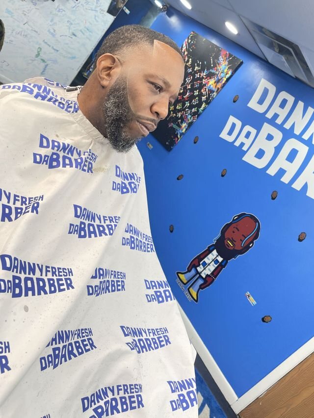 Danny Fresh beard finish and white branded cape