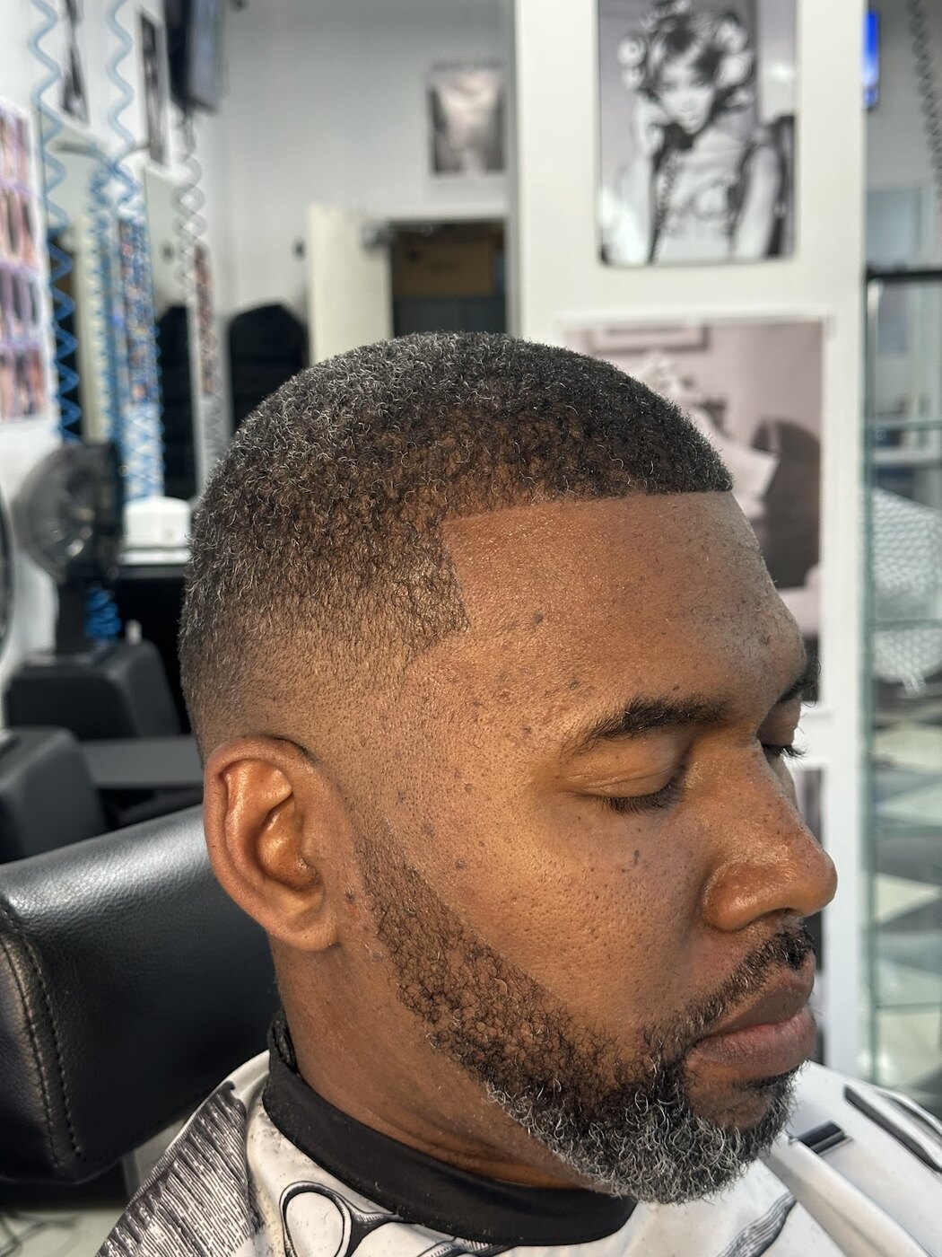 Finished short haircut at His and Hers Barbershop and Salon