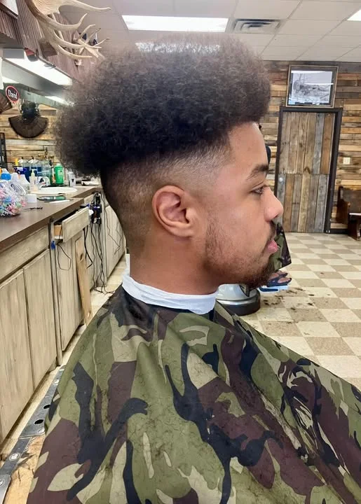 Adult client with a fresh haircut from Jimmy's Barber Shop